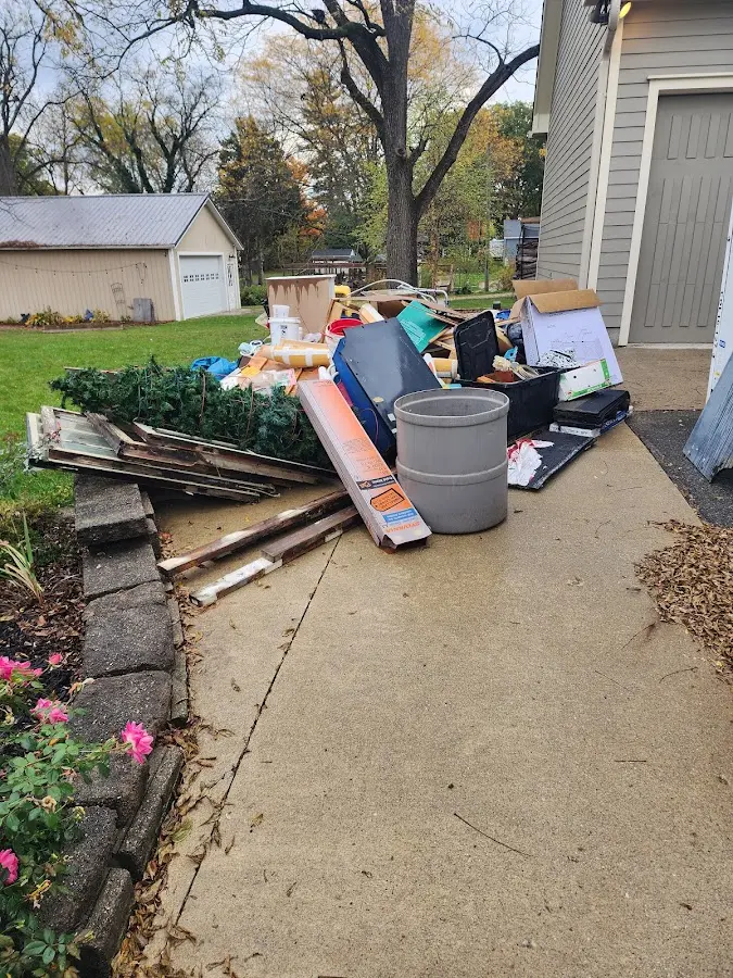 Dumpster being loaded with debris for Demolition Dumpster Rental in Bluffdale